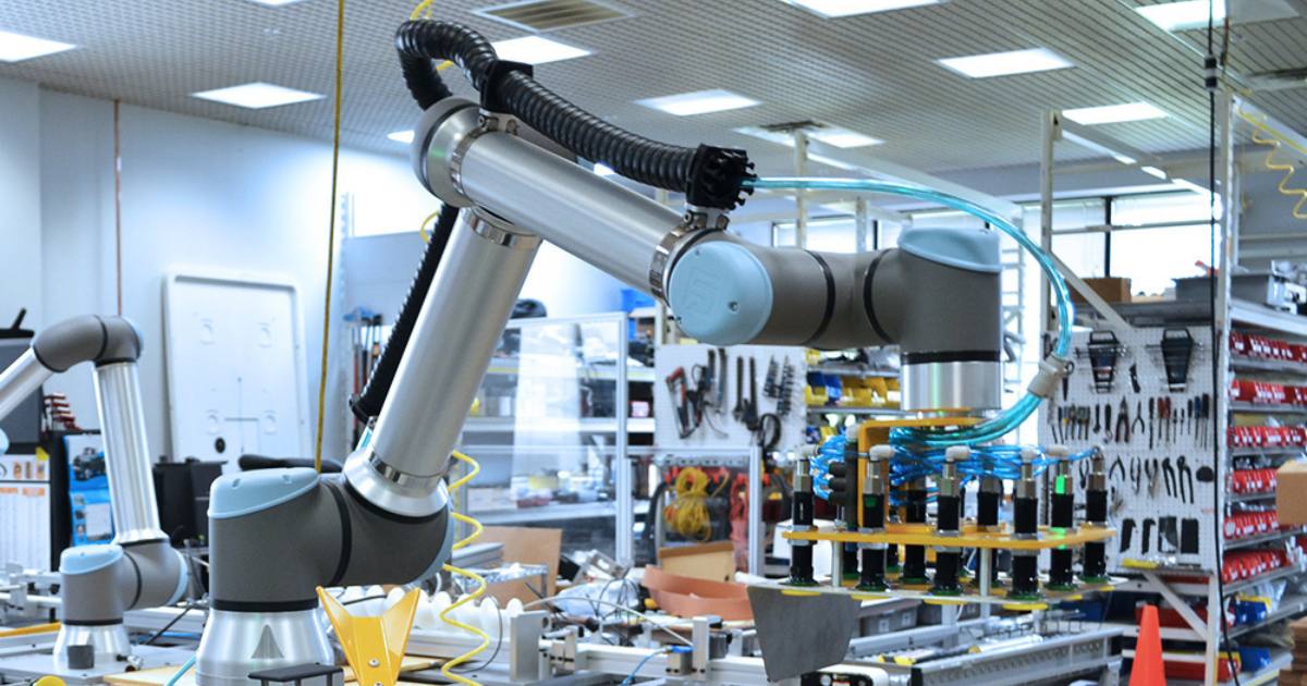 Robotic cell in manufacturing facility alleviating labor shortage related production challenges.
