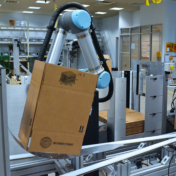 Collaborative Robotic Case Former on manufacturing packing line.