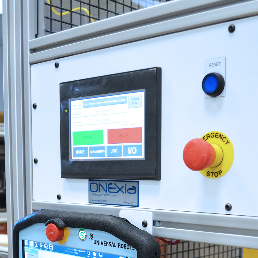 Cobot case packer control panel with ONExia contact information.