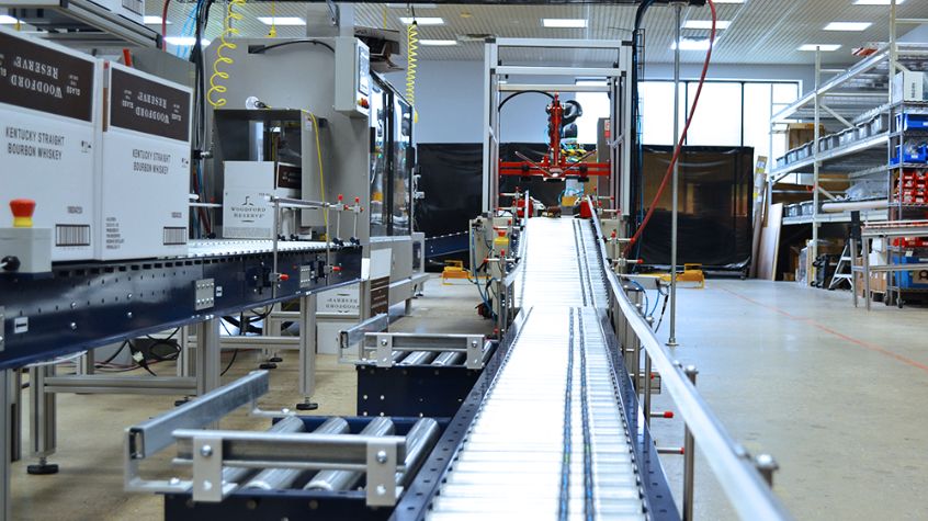 Cobot on manufacturing line improving product packaging efficiency